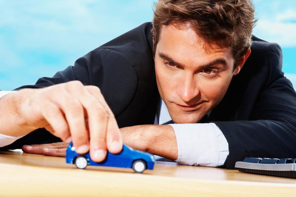 Man Playing Car Toy